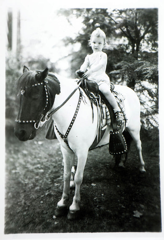 Little Naomi on Horseback